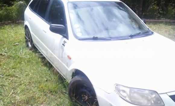 Buy Import Mazda 323 White Car in Noumea in Sud